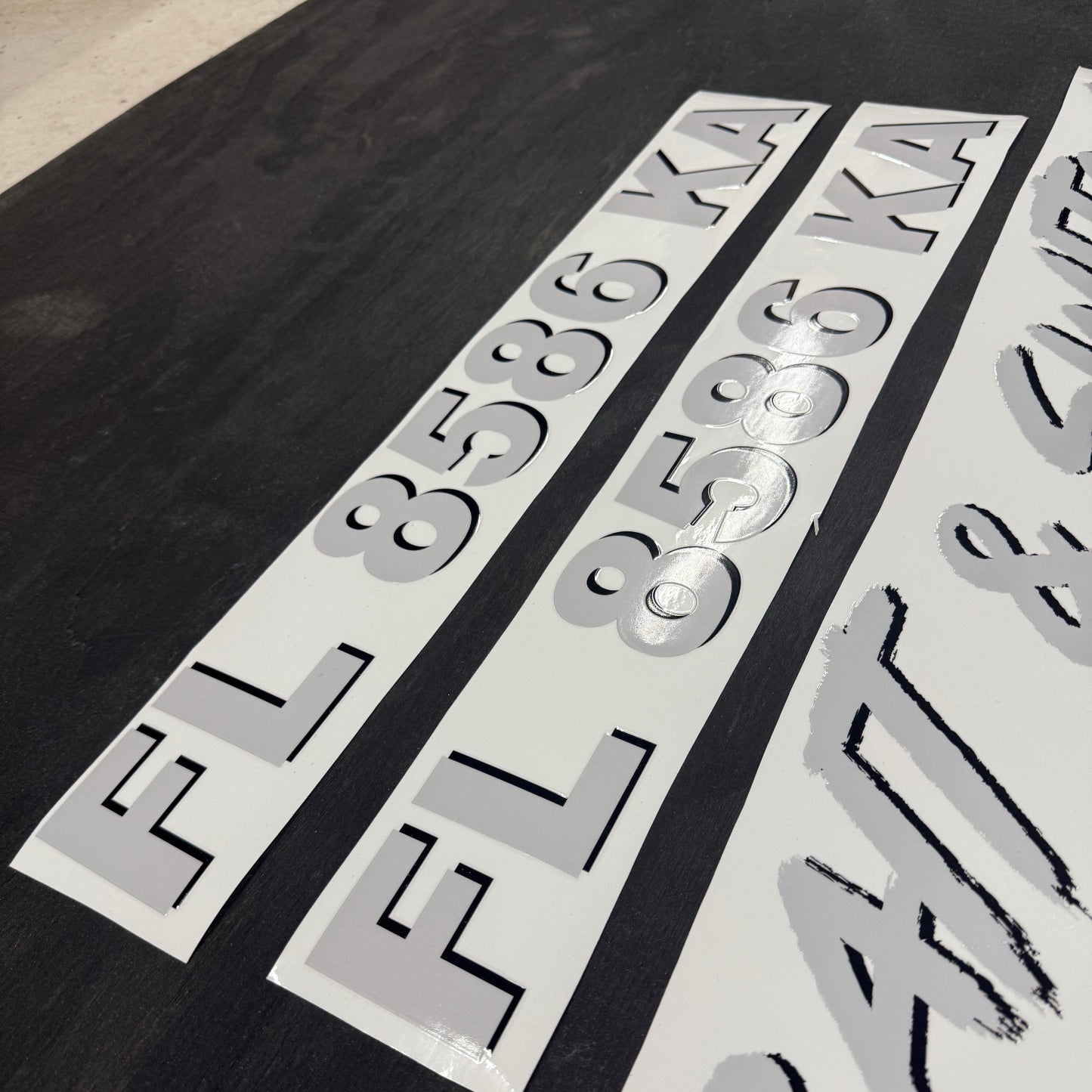 custom gray and black boat registration number decals